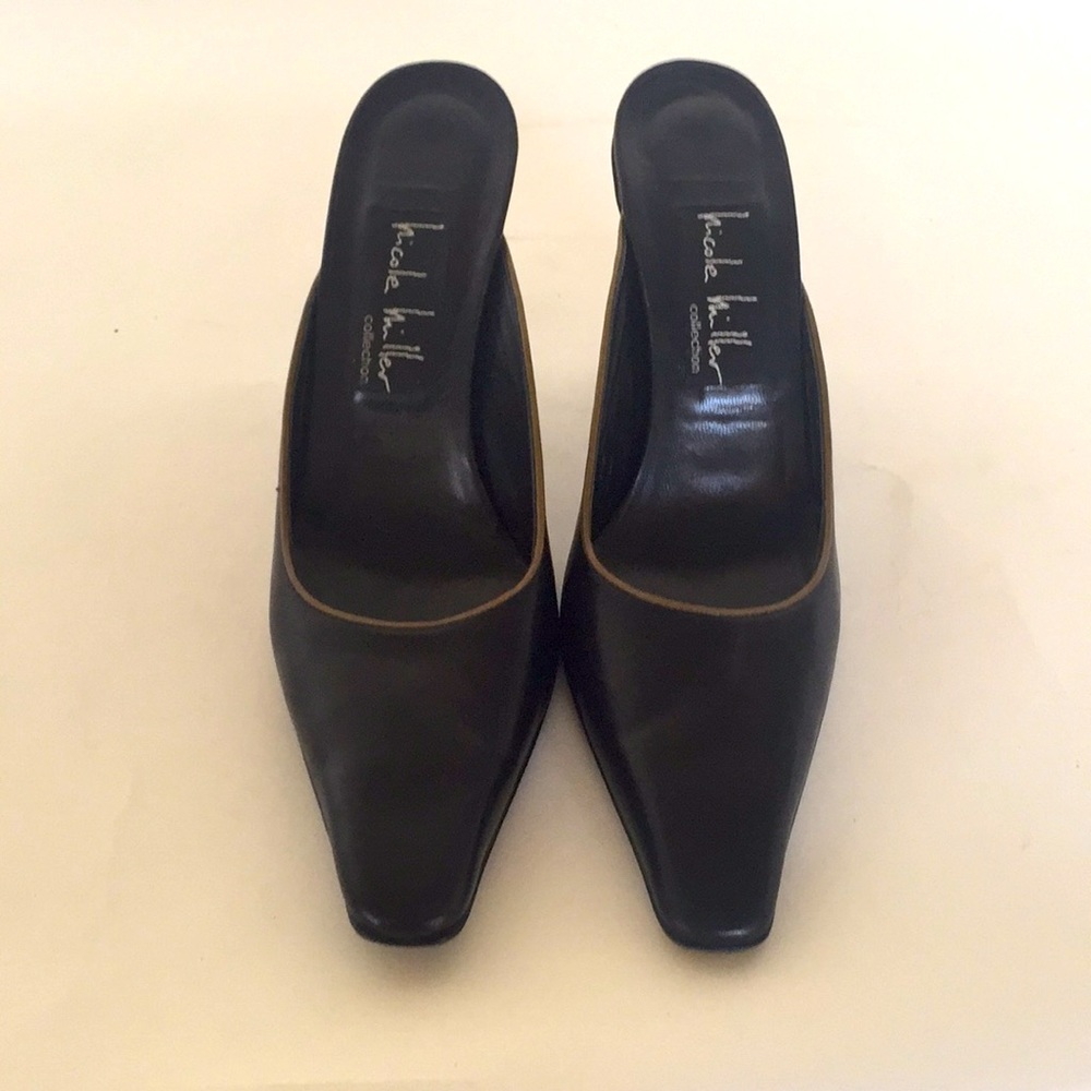 Nicole Miller black leather mules w taupe piping.
